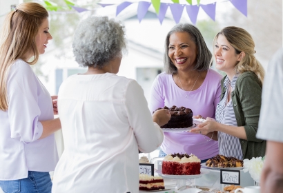 Women celebrating with cake